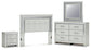 Zyniden Queen Upholstered Panel Headboard with Mirrored Dresser and Nightstand