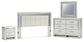 Zyniden King Upholstered Panel Headboard with Mirrored Dresser and Nightstand