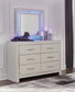 Zyniden Queen Upholstered Panel Bed with Mirrored Dresser and Nightstand